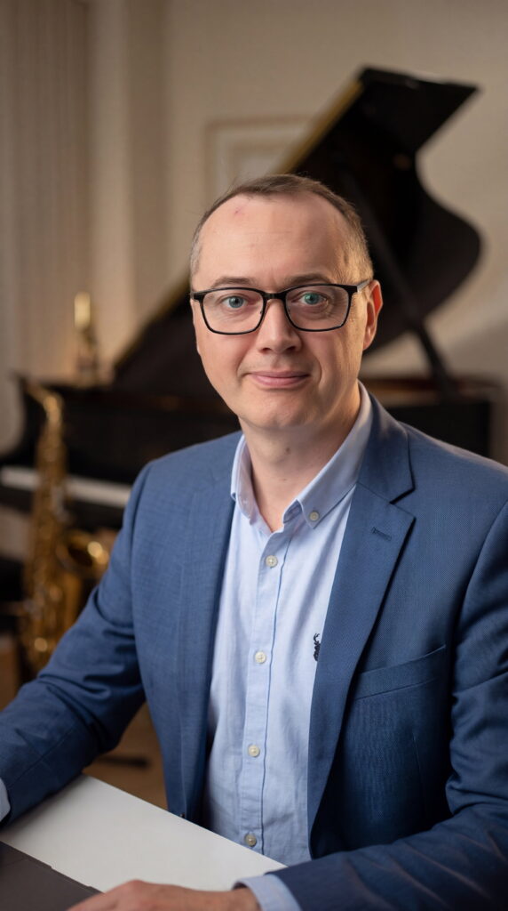 John with piano and sax background